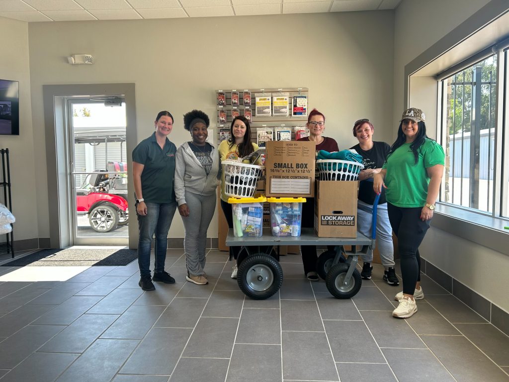 Strat Property Management team and Haven Homes volunteers during a community donation drive in 2025