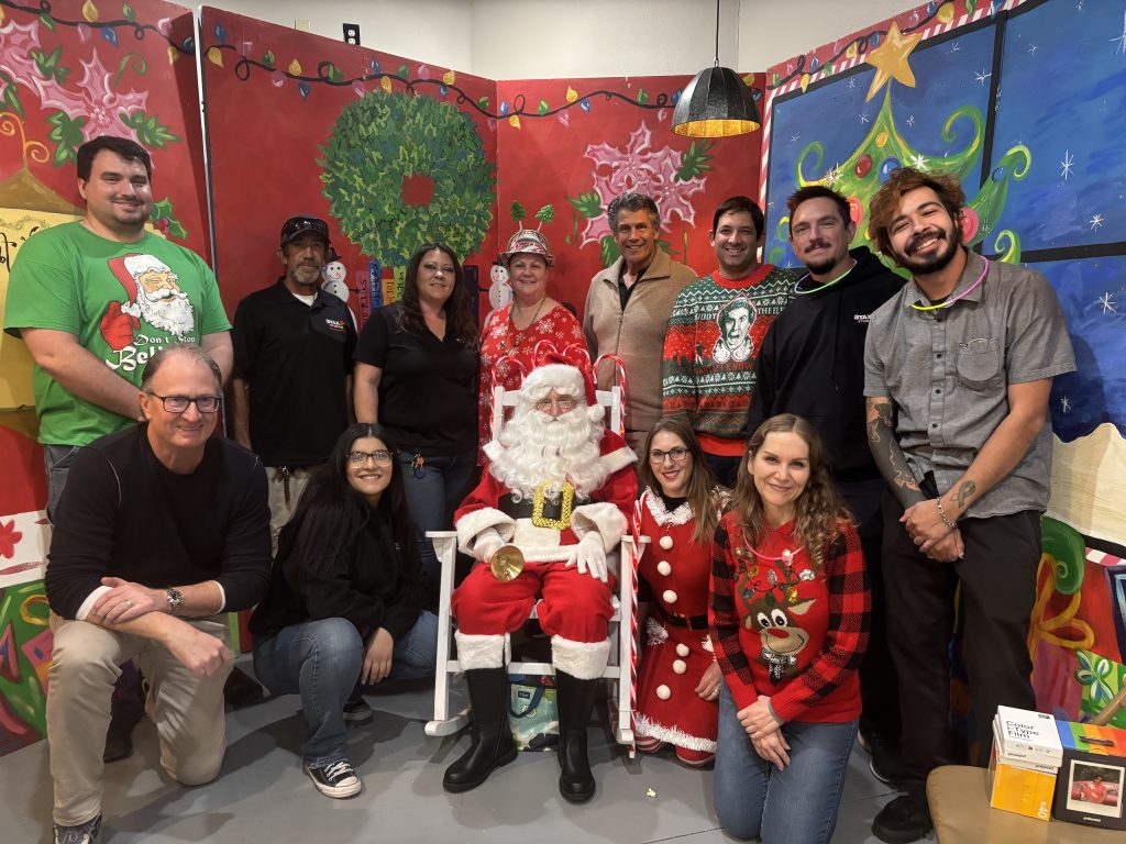 Strat Property Management team members participating in the Gifts of Love community event in 2025