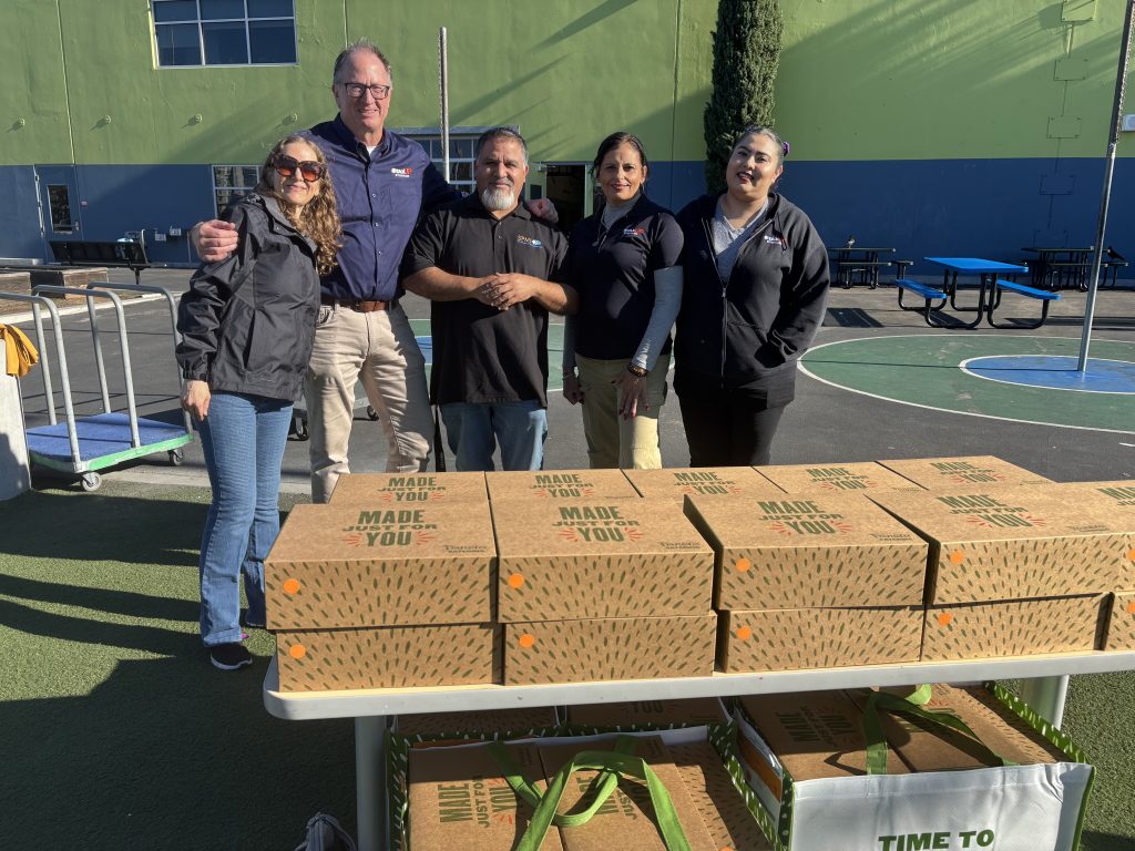 Team at Thanksgiving Meal for Monarch School 2025
