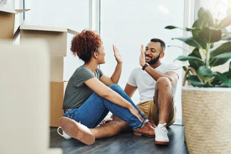Residents settling into their new home, representing the tenant services and support available through the Strat Property Management tenant portal.
